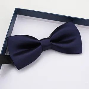 Classic navy blue satin bow tie for men, elegant formal wear accessory in gift box packaging.
