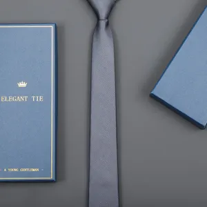 Men's business formal solid grey necktie with elegant blue gift box packaging detail.