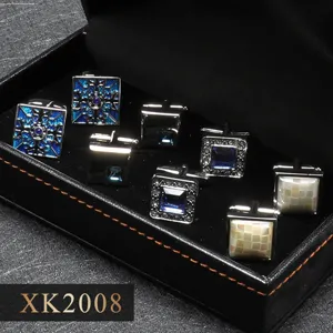 Gedetailleerd overzicht van vier paar luxe Franse manchetknopen in zwarte geschenkdoos.