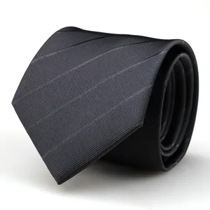 Classic black business necktie for men, elegant textured fabric for formal suit attire details.