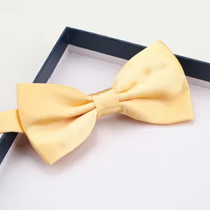 Elegant yellow silk bow tie for men, perfect for weddings, business suits, and formal occasions.