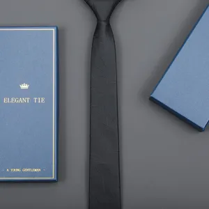 Detail view of classic men business formal black necktie with elegant gift box packaging.