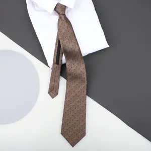 Brown patterned zipper necktie detail showcasing fine textured fabric and neat design.