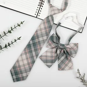 Detailed view of Japanese style JK DK plaid tie and bow tie set, vintage school uniform accessory.