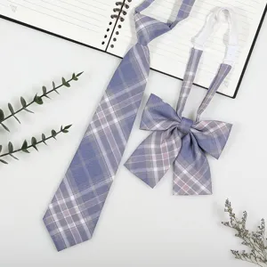 JK style blue plaid tie and bow set detail showing fabric texture and neat stitching.