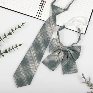 Green plaid JK necktie and bow tie set detail view, student style uniform accessory.