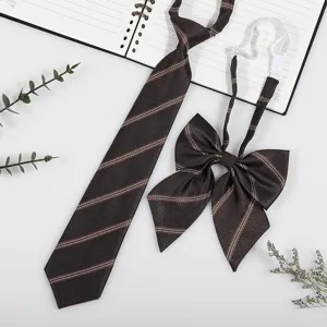 Close-up detail of dark brown striped JK school uniform tie and bow set with adjustable strap.