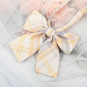 Detailed shot of yellow purple plaid JK bow ribbon, perfect for Japanese school uniform shirt.