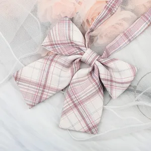 JK uniform plaid bow tie detail shot, cute pink collar ribbon accessory for shirts.