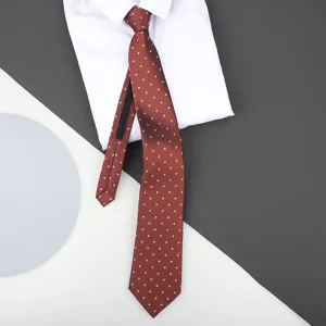 Red zipper tie detail close-up display, elegant geometric pattern, business wear accessory.