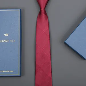 Burgundy striped necktie with blue gift box, elegant formal business wedding tie accessory.