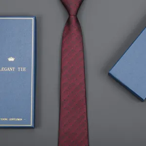 Detailed view of burgundy polka dot necktie texture, elegant men business formal wear detail.