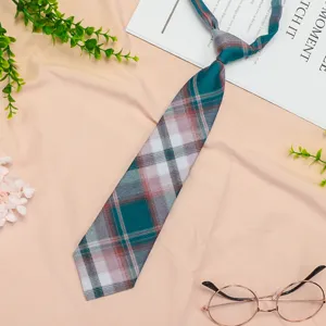 Detailed shot of Japanese JK style plaid necktie with green and pink tartan pattern.