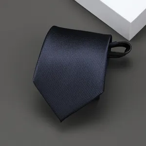 Dark blue striped zipper tie detail, professional business neckwear close-up view.