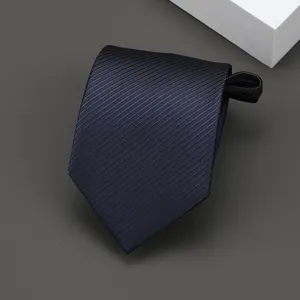 Detailed view of a dark blue striped zipper necktie, showing fine diagonal weave texture and quality craftsmanship.