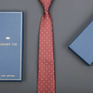 Wine red silk texture business tie detail shot with elegant blue gift box packaging presentation.