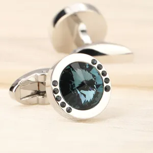 Boutons de manchette français ronds classiques avec pierre bleue et accents noirs élégants.