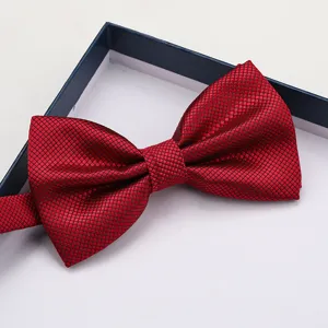 Close-up of a stylish red grid bow tie in a gift box, perfect for formal wear and weddings.