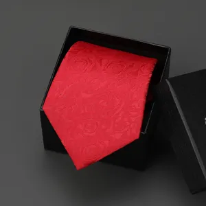 Classic red patterned necktie in luxury black gift box for business and wedding suits.