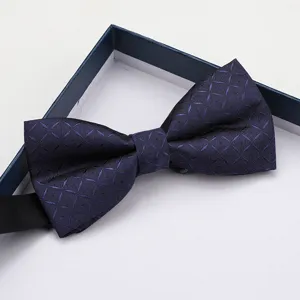 Men formal grid bow tie detail view, elegant navy blue wedding groom suit accessory