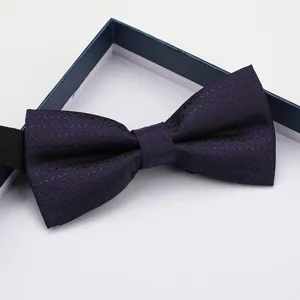 Closeup view of the purple patterned bow tie texture inside gift box detail presentation.