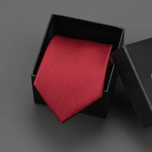 Elegant wine red textured tie presented in a black gift box, ideal for business formal wear.