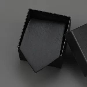 Black business necktie with subtle pattern in gift box, perfect for formal suits and weddings.