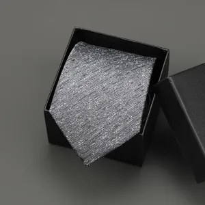 Silver grey textured necktie packaged in an elegant black gift box for business formal wear.