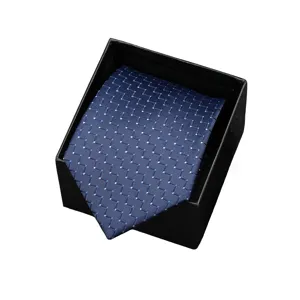 Blue patterned business necktie in gift box, elegant formal wear accessory for men.
