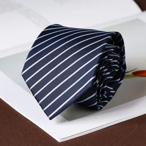 Detailed shot of a classic men's navy blue striped tie, elegant rolled design for business use.