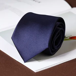 Detail shot of a classic navy blue men's necktie, perfect for business and formal wear events.