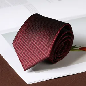Elegant red and black striped necktie for men business formal wear, classic design detail shot.