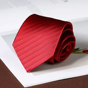 Red striped men's necktie for business and formal wear, stylish rolled accessory design.