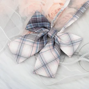Close-up detail of a sweet JK style plaid bow tie ribbon collar accessory with lovely pattern.