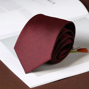 Burgundy herringbone tie detail view, elegant business formal necktie for men and women.
