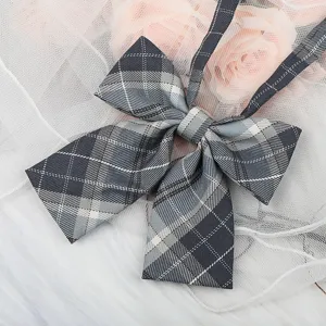 Detailed close-up of a dark grey plaid JK bow tie collar ribbon, perfect for stylish uniform shirts.