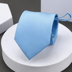 Light blue textured men's necktie close-up, premium fabric weave detail for business attire.