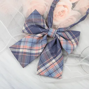 Detailed view of a Japanese JK style plaid bow tie, blue and pink checkered collar accessory.