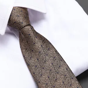 Brown polka dot men's tie business formal suit detail view showcasing fine texture