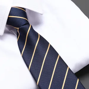 Close-up detail view of classic navy blue men's necktie with elegant gold diagonal stripes.