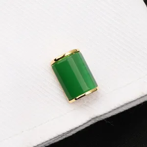 Boutons de manchette cylindriques en pierre verte et bordure dorée pour chemise detail