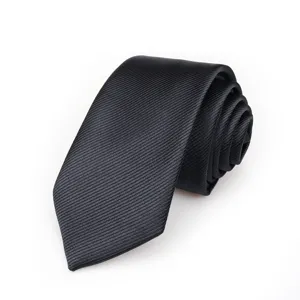 Detailed close-up of a classic black diagonal twill men business necktie product texture.