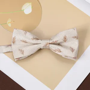 Exquisite retro mens bow tie featuring woven jacquard feather patterns on beige fabric detail.