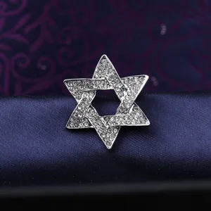 Close-up detail of the sparkling rhinestone star brooch showing exquisite crystal inlay craftsmanship.
