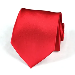 Close-up of a classic wine red silk necktie, neatly folded to show its smooth texture.