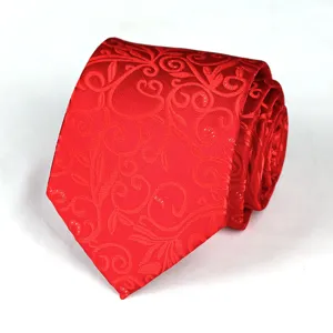 Detailed view of wine red men's jacquard woven tie showcasing elegant floral swirl pattern.