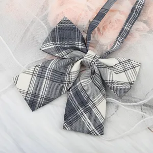 Close-up detail of a classic Japanese JK uniform plaid bow tie ribbon collar accessory.