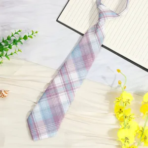 Detailed view of a Japanese JK plaid pre-tied necktie, featuring cute pastel checkered pattern.
