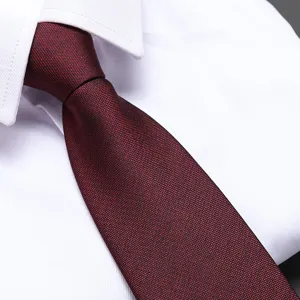 Burgundy textured necktie close-up, classic formal business menswear accessory for weddings.