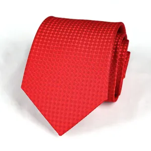 Close up detail of a red woven necktie, featuring fine textured pattern for business wear.